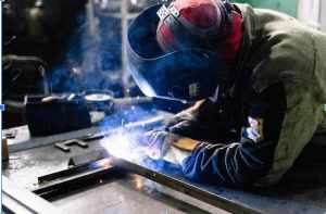 A PTTI student gets hands-on training for a welder career